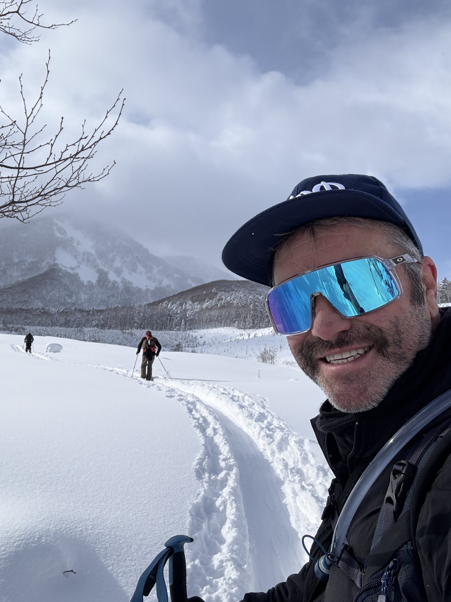 Ash Johns exploring the mountains of Hokkaido with ski guests
