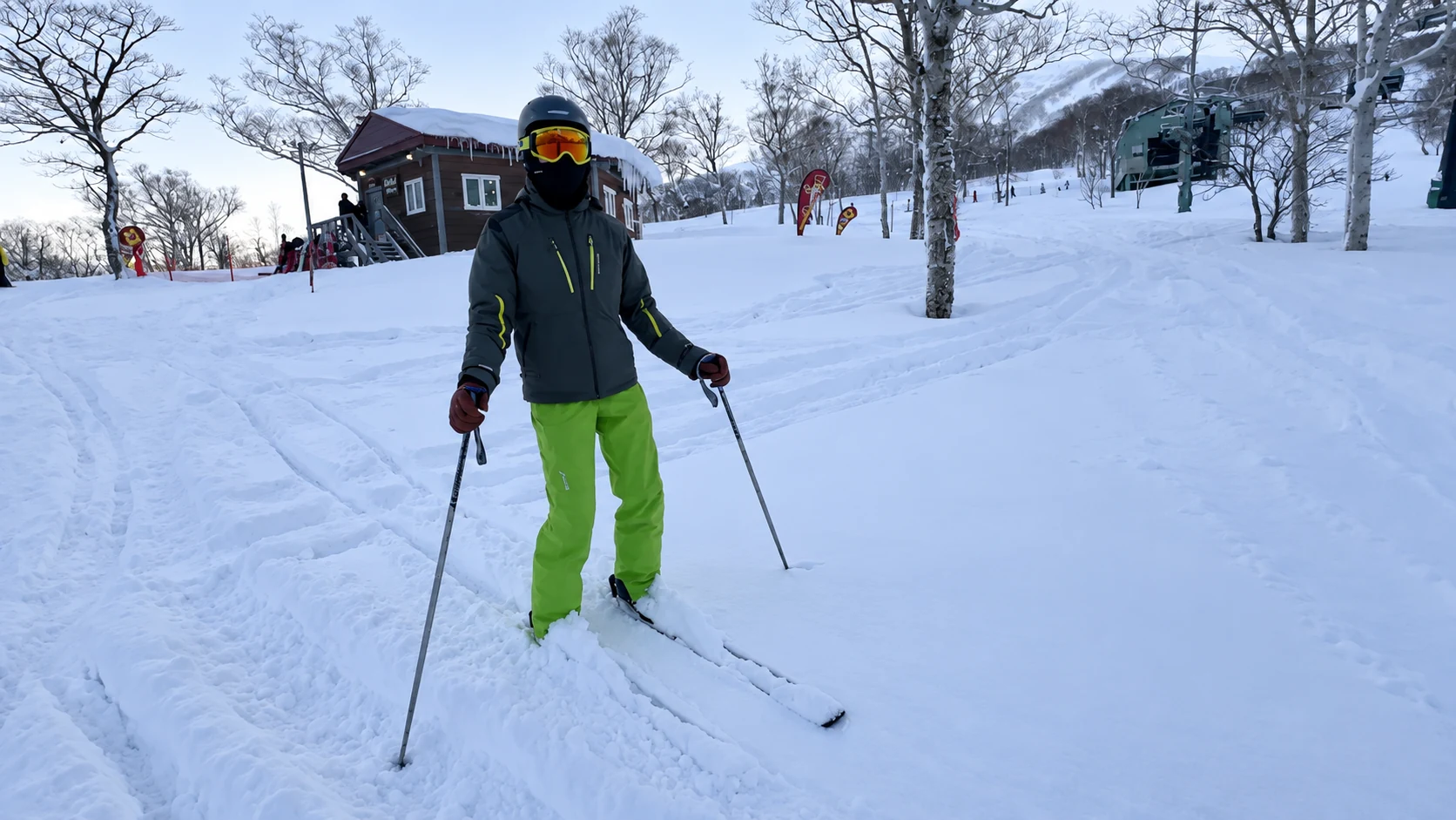 Skier standing in fresh powder at Niseko Grand Hirafu