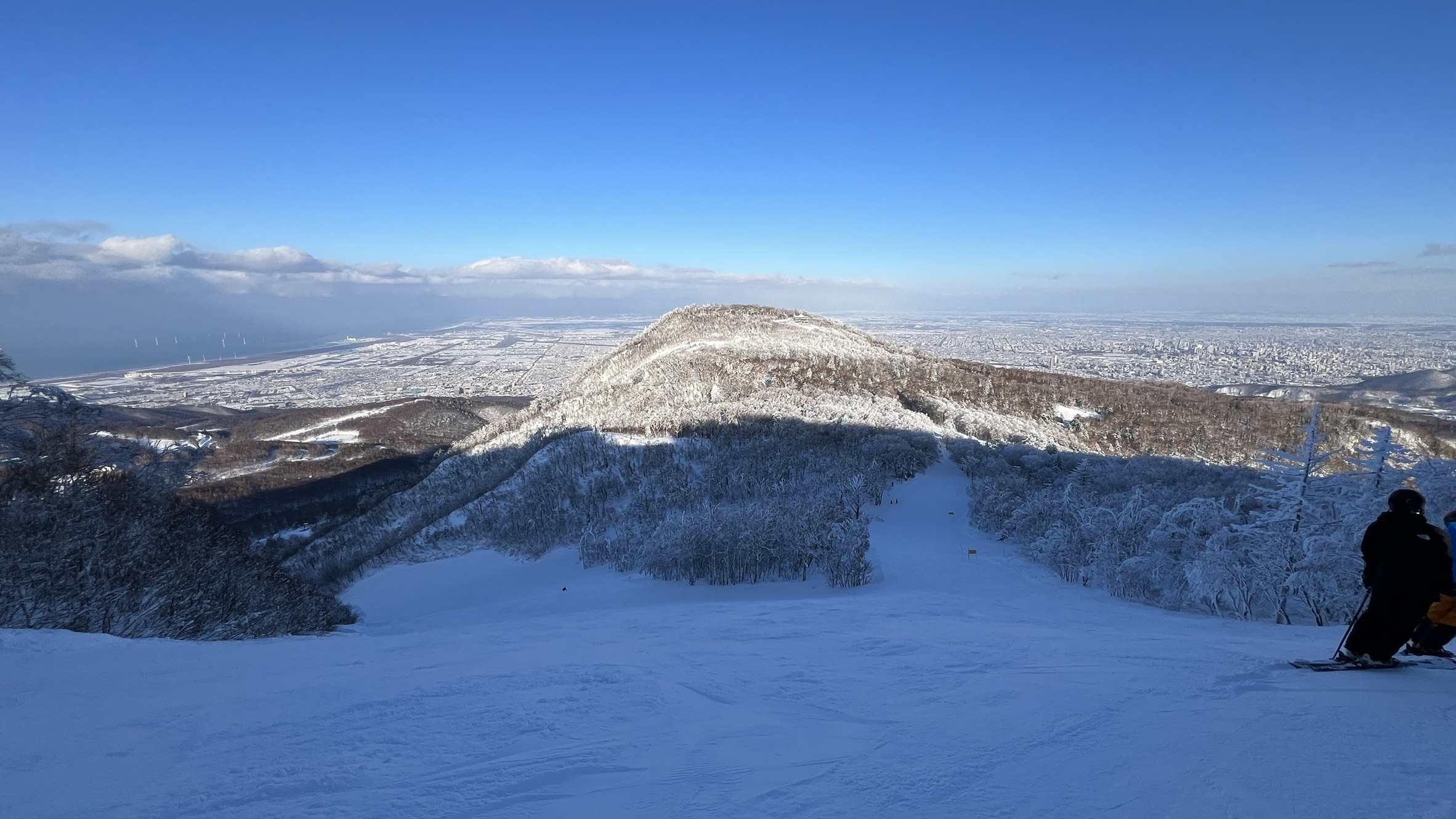 Ocean and Sapporo city views from the ski slopes at Sapporo Teine